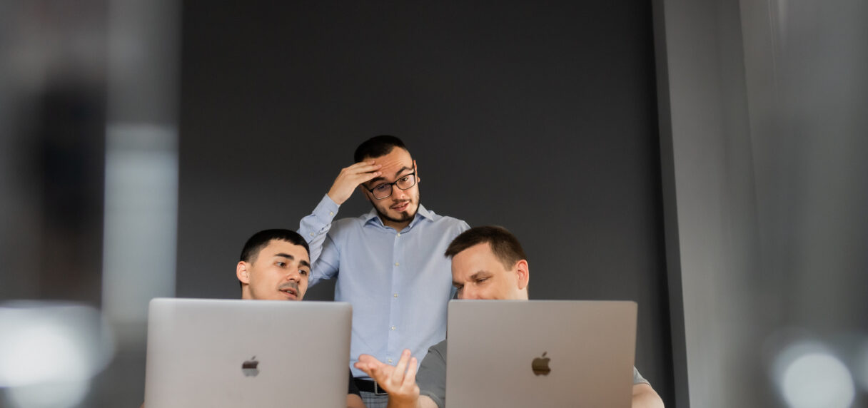 ecommerce team analyzing website performance and facing conversion issues on laptops