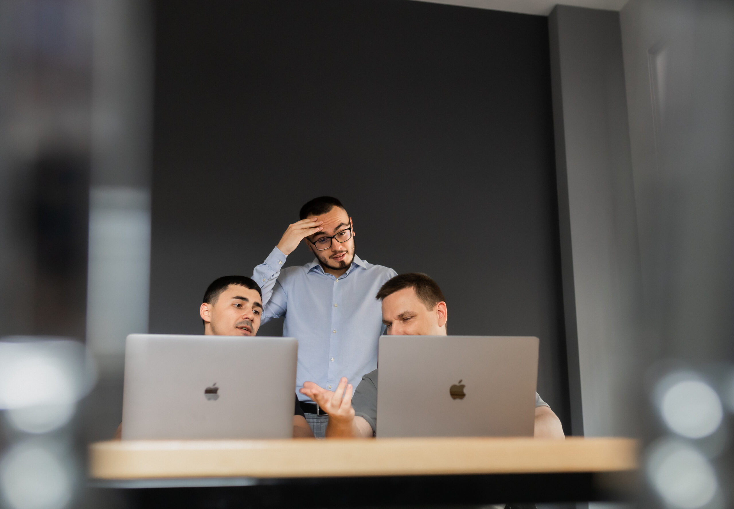 ecommerce team analyzing website performance and facing conversion issues on laptops