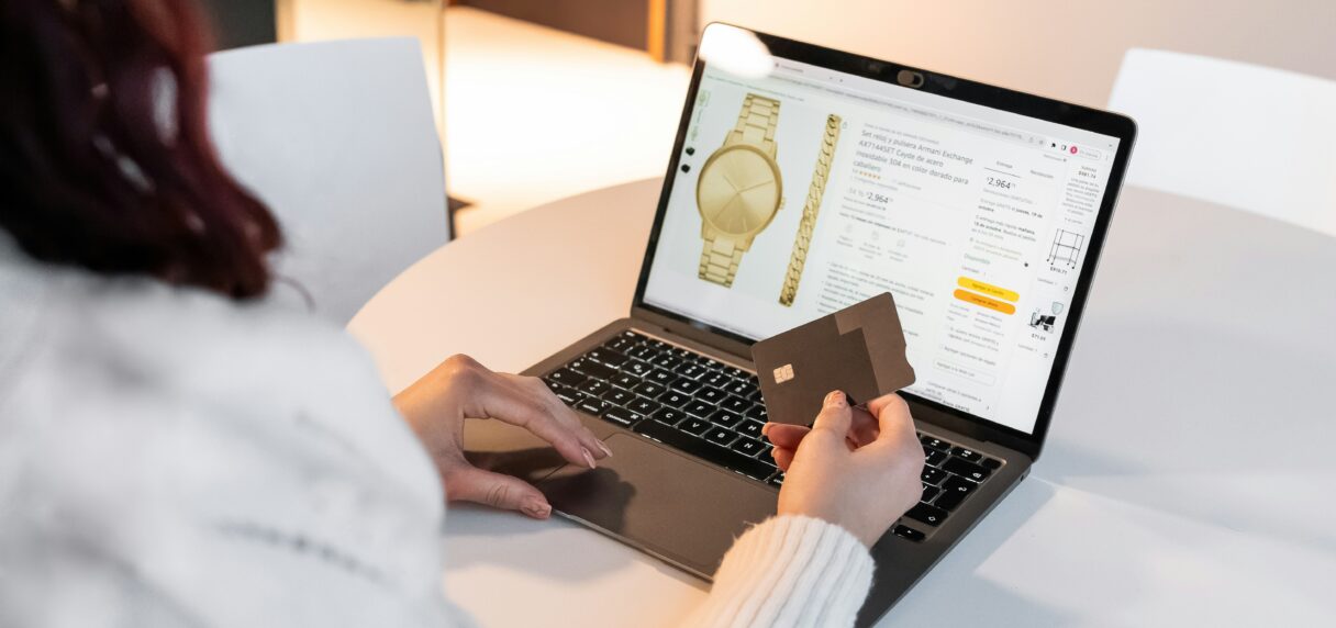 Woman shopping online on a laptop, premium Shopify fashion store